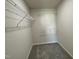 A walk-in closet with carpet and wire shelving on the walls at 261 Phil Jack Rd, Dunn, NC 28334