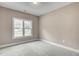 Bedroom features a window and neutral carpeting at 2820 Tara Dr, Clayton, NC 27520