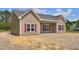 Charming single-story home with tan siding, red shutters, and a well-manicured lawn at 2820 Tara Dr, Clayton, NC 27520