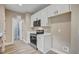 Well-lit kitchen features stainless steel appliances, white cabinetry, and neutral wall color at 2820 Tara Dr, Clayton, NC 27520