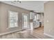 Modern kitchen with white cabinets, stainless steel appliances, and hardwood floors at 2820 Tara Dr, Clayton, NC 27520