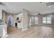 Modern kitchen with white cabinets, stainless steel appliances, and hardwood floors at 2820 Tara Dr, Clayton, NC 27520