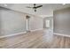 Spacious living room with hardwood floors, neutral walls, ceiling fan, and ample natural light at 2820 Tara Dr, Clayton, NC 27520