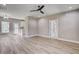 Spacious living room with hardwood floors, neutral walls, ceiling fan, and ample natural light at 2820 Tara Dr, Clayton, NC 27520