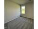 Comfortable bedroom featuring a window and neutral color palette at 299 Phil Jack Rd, Dunn, NC 28334
