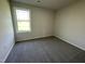 Cozy bedroom featuring a window that fills the space with natural light at 299 Phil Jack Rd, Dunn, NC 28334