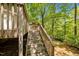 A staircase leads from the deck to the lush backyard. Perfect place to relax at 300 Nc 54 # E3, Carrboro, NC 27510