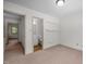 Bedroom with neutral carpet and view into bathroom and hallway at 300 Nc 54 # E3, Carrboro, NC 27510