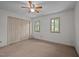 Bedroom featuring two windows for natural light, neutral carpet, and ceiling fan at 300 Nc 54 # E3, Carrboro, NC 27510