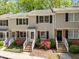 Charming townhome with classic black shutters, brick accents and landscaped entrance at 300 Nc 54 # E3, Carrboro, NC 27510