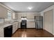 Stylish kitchen with stainless steel appliances, granite countertops and custom cabinets at 300 Nc 54 # E3, Carrboro, NC 27510