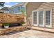 Outdoor patio area featuring stone pavers and a brick fireplace at 30038 Village Park Dr, Chapel Hill, NC 27517
