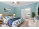 Inviting bedroom with blue accents, a woven headboard, and natural light from a window at 30038 Village Park Dr, Chapel Hill, NC 27517
