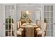 Charming dining room featuring hardwood floors, a stylish chandelier, and elegant decor at 30038 Village Park Dr, Chapel Hill, NC 27517