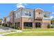 Two-story commercial building featuring gray and brick facade and clearly visible signage at 30038 Village Park Dr, Chapel Hill, NC 27517