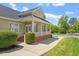 Charming home exterior with a covered front porch and manicured landscaping at 30038 Village Park Dr, Chapel Hill, NC 27517