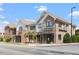 Two-story commercial building featuring brick and gray facade, with street-level retail at 30038 Village Park Dr, Chapel Hill, NC 27517