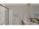 Bathroom featuring modern fixtures, a tub, a vanity with a marble countertop, and soft, neutral colors at 307 Burke St, Dunn, NC 28334
