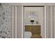 Tastefully designed bathroom with sleek fixtures, a stylish round mirror, and a modern shower at 307 Burke St, Dunn, NC 28334