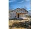 Unfinished new home construction showing framing, wrapping and construction site at 307 Burke St, Dunn, NC 28334
