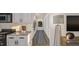 Hallway with art and access to the kitchen at 307 Burke St, Dunn, NC 28334