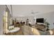 Open-concept living room with dining area and an island with seating at 307 Burke St, Dunn, NC 28334
