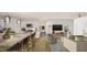 This open-concept living room showcases a kitchen with a granite island and a living area with stylish decor at 307 Burke St, Dunn, NC 28334