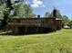 Home showcasing a wooden deck and spacious backyard, perfect for outdoor entertaining at 311 N Nash St, Hillsborough, NC 27278