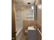 Modest bathroom featuring a standard toilet, tub, and minimal vanity at 311 N Nash St, Hillsborough, NC 27278