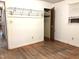 Bedroom featuring hardwood floors, closet, and a window at 311 N Nash St, Hillsborough, NC 27278