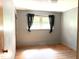 Bedroom featuring hardwood floors and a bright window at 311 N Nash St, Hillsborough, NC 27278
