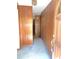 Inviting entryway featuring paneled walls and carpet flooring at 311 N Nash St, Hillsborough, NC 27278