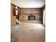 Cozy living room with a brick fireplace, built-in shelving, and natural light at 311 N Nash St, Hillsborough, NC 27278