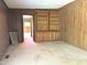 Inviting living room with wood-paneled walls, built-in shelving, and natural light at 311 N Nash St, Hillsborough, NC 27278