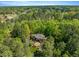 Aerial view of the estate surrounded by lush, mature trees at 3203 Cameron Dr, Henderson, NC 27536