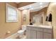 Bright bathroom featuring a large mirror, ample counter space, and a clean, neutral design at 3203 Cameron Dr, Henderson, NC 27536