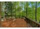 Outdoor deck with seating area overlooking a lush green space at 3203 Cameron Dr, Henderson, NC 27536
