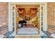 Elegant foyer with tiled floor, grand staircase, chandelier, and piano at 3203 Cameron Dr, Henderson, NC 27536