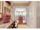 Hallway leading to a dining area with ample natural light at 3203 Cameron Dr, Henderson, NC 27536