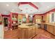A kitchen showcases wooden cabinets, a marble island with a gas range, and stainless steel appliances at 3203 Cameron Dr, Henderson, NC 27536