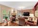 Elegant living room with a cozy fireplace, and access to the outdoor balcony at 3203 Cameron Dr, Henderson, NC 27536