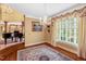 Bright living room with hardwood floors, chandelier, and large windows at 3203 Cameron Dr, Henderson, NC 27536