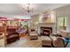 Bright living room featuring a fireplace, and an open floor plan at 3203 Cameron Dr, Henderson, NC 27536