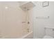 Full tub and shower with neutral tile and white walls at 3605 Moonlight Dr, Chapel Hill, NC 27516