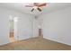 Bedroom with carpeting, a ceiling fan, and a doorway to other rooms at 3605 Moonlight Dr, Chapel Hill, NC 27516