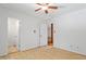 Neutral bedroom with ceiling fan, wood floors, and plenty of closet space at 3605 Moonlight Dr, Chapel Hill, NC 27516