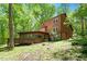 A beautiful two-story home nestled among lush trees creating a private, wooded setting at 3605 Moonlight Dr, Chapel Hill, NC 27516