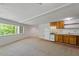 A kitchenette with wood cabinets and neutral countertops at 3605 Moonlight Dr, Chapel Hill, NC 27516