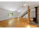 Bright and airy living room boasts hardwood floors, skylights, and a cozy fireplace at 3605 Moonlight Dr, Chapel Hill, NC 27516