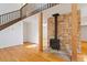Cozy living room featuring a fireplace and wood floors, with staircase leading to upper level at 3605 Moonlight Dr, Chapel Hill, NC 27516
